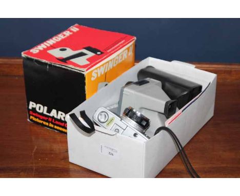 POLAROID LAND CAMERA AND A POLAROID SWINGER II LAND CAMERA
along with accessories and other cameras 