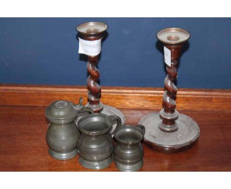 WALNUT CASED MANTEL CLOCK 
also a pair of oak spiral turned candlesticks and three 19th Century pewter measures (6)