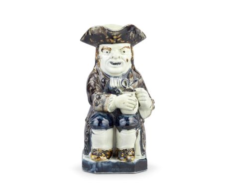 A Staffordshire pearlware Toby Jug, circa 1790Of traditional form, seated and holding a foaming jug in both hands, a novelty 