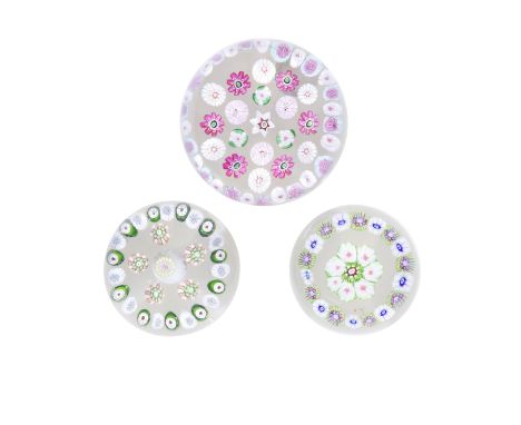 Three French patterned millefiori paperweights, circa 1850Comprising a Pantin weight with a central star cane within two rows