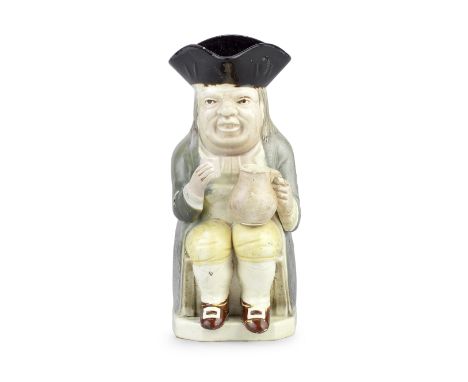 A small Wood Family Toby jug, circa 1785-90Of 'Mould 51' type, seated and holding a jug in his left hand and a glass in his r