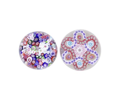 A Baccarat close-packed millefiori paperweight and a Baccarat double-trefoil garland weight, circa 1845-50The first with an a