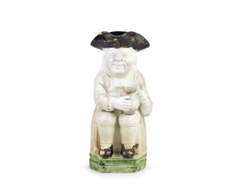 A Staffordshire pearlware 'Double Base' Toby Jug, circa 1790Of traditional form and seated on a rare 'Double Base' washed in 