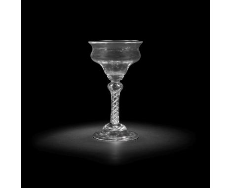 An airtwist sweetmeat glass, circa 1750The double ogee bowl set on three graduated collars above a shoulder-knopped stem encl