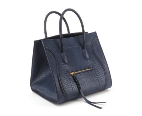 Celine Navy Blue Medium Luggage Phantom Handbag In Full Python. Leather lining. Zipper pockets inside and out. Embossed label