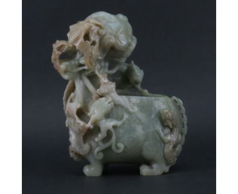 A 19/20th Century Carved Jade Figural Vase. Green and shades of Brown carved in deep relief with Chimera of various sizes. Un