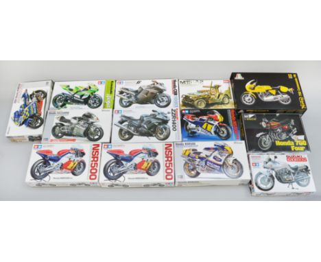 12 x plastic model kits mostly 1:12 scale motorcycles by Hasegawa , Tamiya, etc, but also including an Academy Jeep. E, unuse