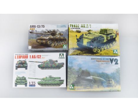 Four Takom 1:35 scale plastic model kits: three tanks; Vidawagen Rocket. E, unused. (4)