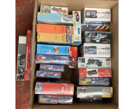 23 x plastic model kits, all cars by Airfix, Revell and others, mostly 1:24 scale, besides a 1:32 scale Airfix Ford Fiesta. B