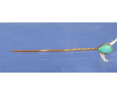 A gentleman's Tiepin with tear shaped finial set with a turquoise all in yellow metal.