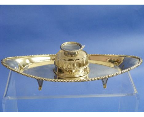 An Edwardian silver Ink Stand, by Thomas Bradbury & Sons Ltd, hallmarked Sheffield, 1902, of oval boat-shaped form with gadro