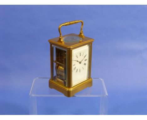 A French gilt brass repeating Carriage Clock, of five-glass form with white enamel dial and Roman numerals, the 8-day twin-tr