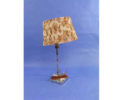 An Art Deco chromed Venetian Gondola table lamp, on square base, 11in (28cm) high excluding shade.