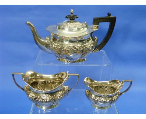 A matched Edwardian silver three-piece Tea Set, the teapot by John Edward Wilmot, hallmarked Birmingham, 1902, the sugar bowl