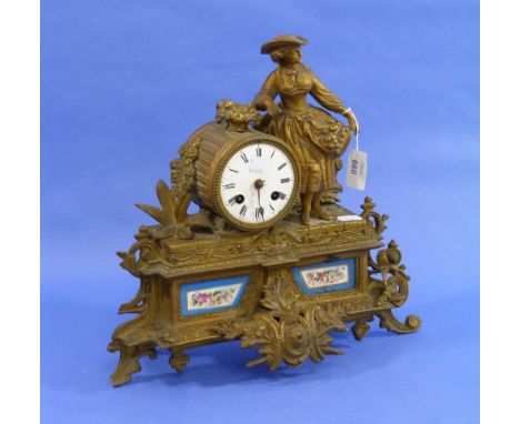A 19thC French gilt-metal figural Mantel Clock, with Sevres-style ceramic panels, damaged, 14in (35.5cm) wide.