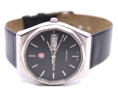 Men's Vintage 1970's? Rado Voyager Automatic wristwatch.  The watch has a black dial with the Rado Logo in silver lettering a