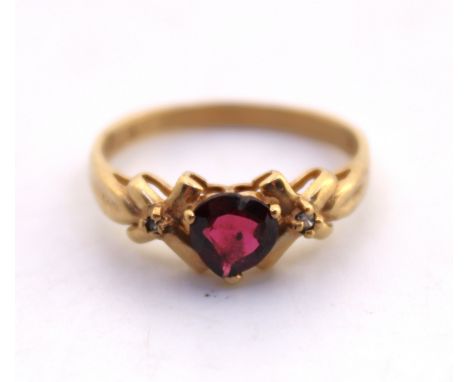 9ct Yellow Gold Heart Shaped Garnet and Cubic Zirconia Ring.  The Heart Shaped Garnet measures approx. 5.85mm length  x 6.10m