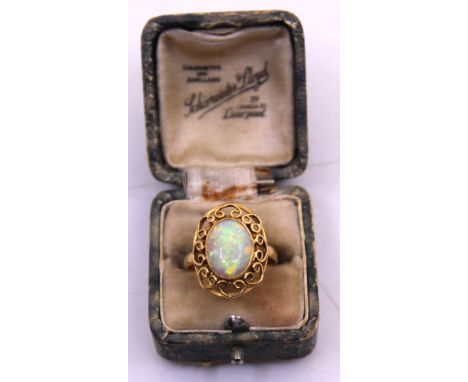 18ct Yellow Gold Oval Opal Cabochon ring. Length:12.12mm x Width: 9.21mm x 2.80mm depth.  The Oval Opal Cabochon is showing a