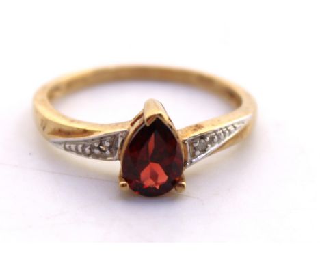 9ct Yellow Gold Pear Cut Garnet and Diamond Ring.  The Garnet measures approx. 7mm in length and there is a melee Round Brill