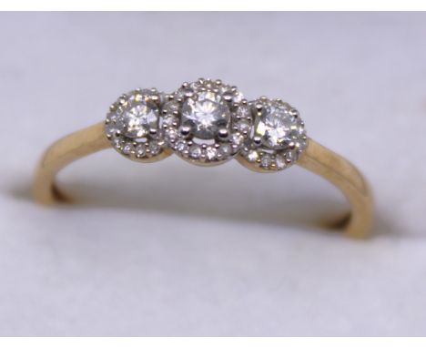 9ct Yellow Gold Three Stone Round Brilliant Cut Diamond ring with surrounding Round Brilliant Cut Diamonds Halo Design.  The 