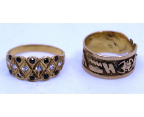 Two Unmarked Yellow Metal rings.  To include a unmarked yellow metal ring with Egyptian symbols decoration around the ring. T