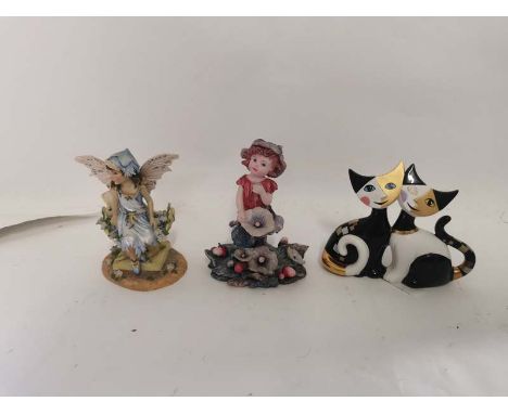 A porcelain Goebel cat figure together with two figures of fairies. (3)