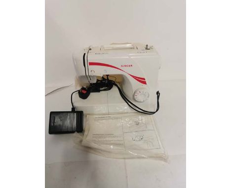 A Singer model 1507 sewing machine with cover and manual. (1)