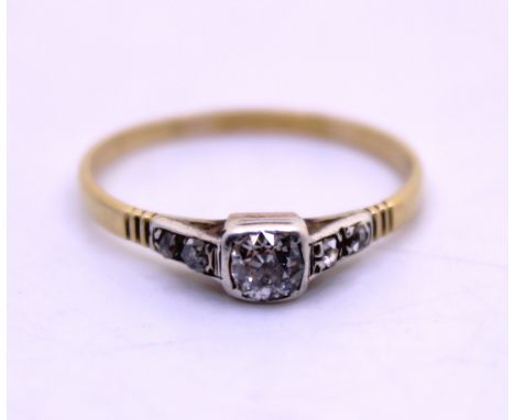 Unmarked Yellow Metal Approx. 0.20ct Old European Cut Diamond Ring with Old European Cut Diamond Shoulders.  The Diamond Colo