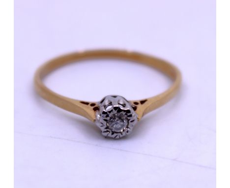 18ct Yellow Gold Approx. 0.10ct Ilusion Set Solitaire Round Brilliant Cut Diamond Engagement Ring.  The ring is hallmarked "7