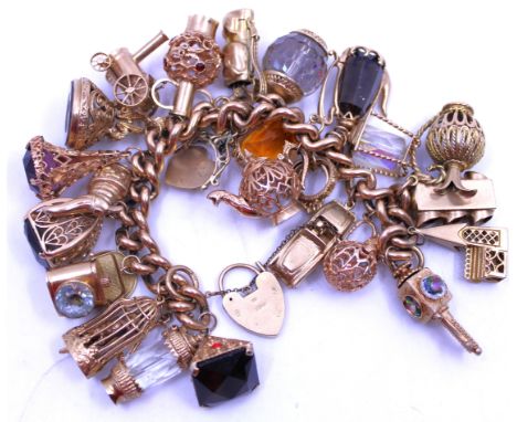Chunky 9ct Rose Gold Bracelet with Twenty Five 9ct Gold and Unmarked Yellow Metal charms and safety chain.  The charms are to
