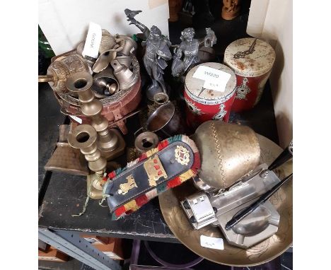 Part shelf of brass ornaments including candlesticks, brass bell, pair of Cadburys drinking chocolate tins etc