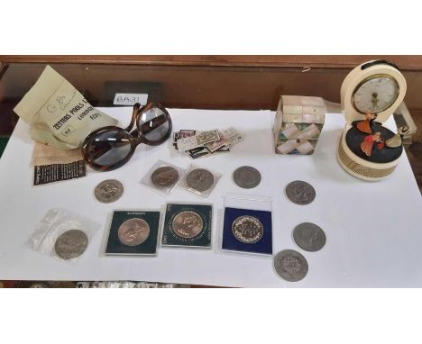 Shelf of collectables, mother of pearl box with glass bottle, music alarm clock, commemorative coins etc
