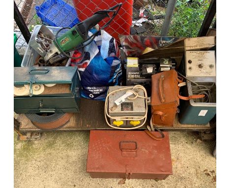 Shelf of mixed electrical tools including massicore 110V converter box, Hitachi disc cutter etc