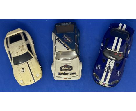 3 x Various Cars in Racing Livery 1:32 Scalextric type slot racing cars unboxed with some ageing fair, good condition. We com