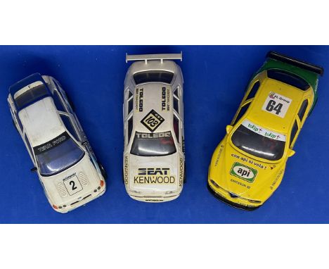 3 x Various Cars in Racing Livery 1:32 Scalextric type slot racing cars unboxed with some ageing fair, good condition. We com