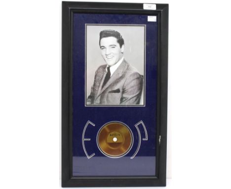 Elvis Presley - The Kings Hair - an authenticated framed picture with a piece of Elvis Presleys Hair. With information on the