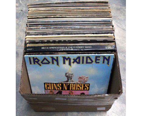 A box of Vinyl LP Records mostly rock and metal and Pop Including Ronnie Wood, Jethro Tull, Iron Maiden including a Signed LP