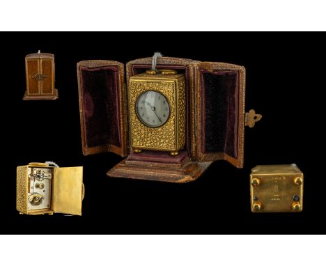 Miniature Gilt Carriage Clock, Porcelain Dial, Arabic Numerals. Marked To Case Base SFG Depose Geneve, Movement Marked John H