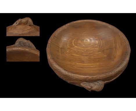 ROBERT THOMPSON OF KILBURN, A MOUSEMAN OAK NUT BOWL circular, the adzed exterior with small carved mouse signature, 6 inch di