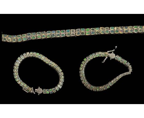 Opal Double Row Bracelet, two rows of oval cut opals, displaying a beautiful array of colours, totalling approx. 10cts, close