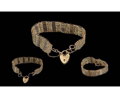 Ladies - Quality 9ct Gold Nine Bar Gate Bracelet with Heart Shaped Padlock. Marked 9.375. Excellent Warm Gold Colour and a We