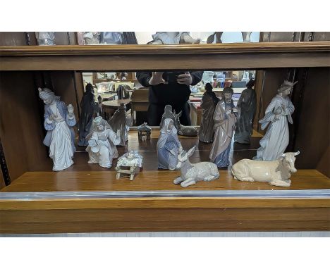 A Complete Nao and Lladro Nativity Set to include 8 Porcelain Figures to include three wise men, cow, donkey, Mary and Joseph