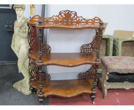 A Mid XIX Century Rosewood Serpentine Shaped Three Tier What-Not, with pierced and shaped back, three shelves and turned and 