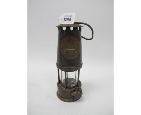 Miners Lamp, The Protector, Eccles, type SL '65' to applied plaque, 24cm high with handle down.