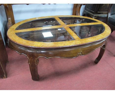 A XX Century Chinese Style Walnut Oval Shaped Coffee Table, with four panel glass top and shaped frieze.