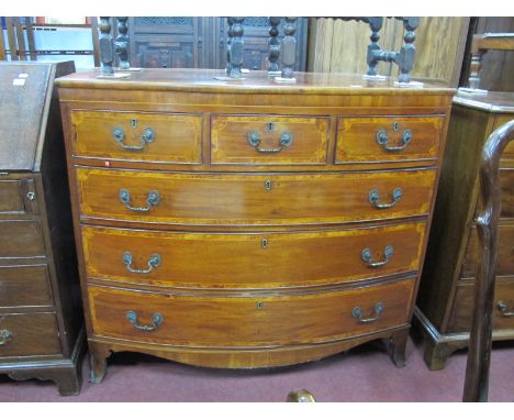 A XIX Century Mahogany Bow Fronted Chest, with three small and three long drawers, crossbanding to the top and drawers, on br