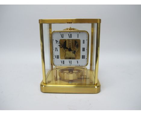A Jaeger-Le-Coultre Atmos Clock, in brass case, the square dial with black Roman numerals on white ground, the movement stamp