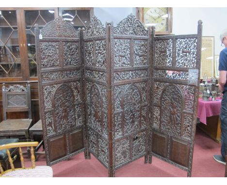 A Late XIX/Early XX Century Indian Hardwood Four Fold Screen, decorated with figures, animals and foliage (some damage) missi