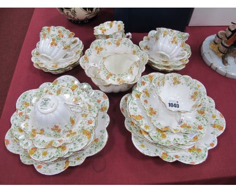 An Early XX Century Foley Part Tea Service, of fluted petal shape, printed and overpainted in pattern number 6948 with red an