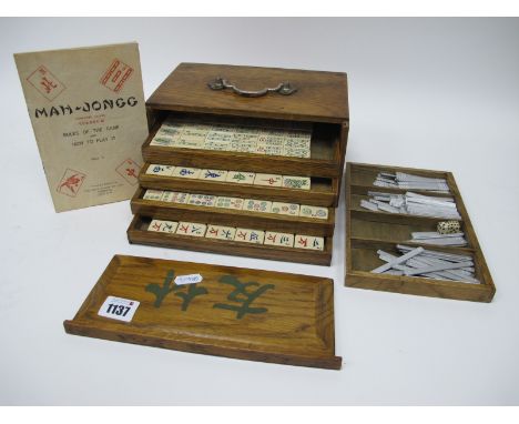 A Chad Valley Co Ltd Mah-Jong Set, the wooden case with five pull-out drawers containing composition counters and metal stick